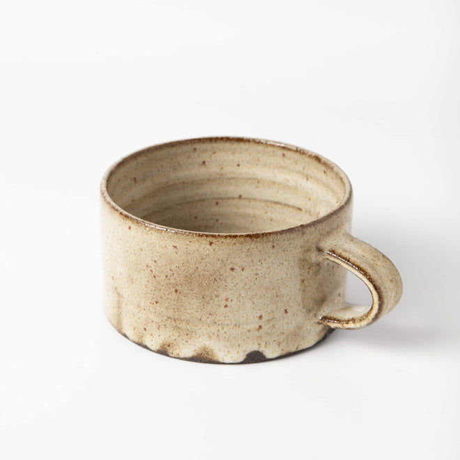 hand made wide ceramic mug with speckled natural glaze